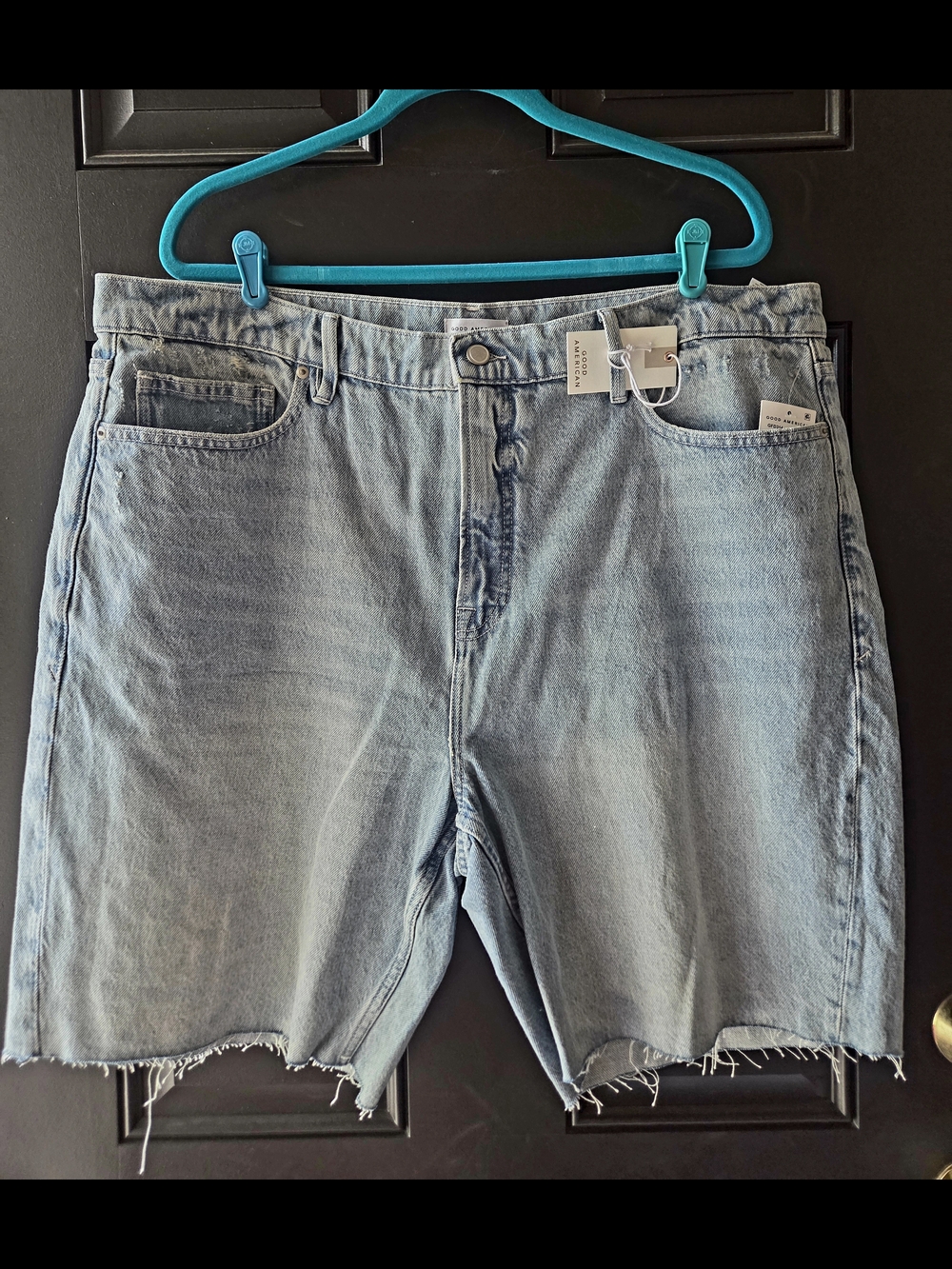Good American Light Wash Denim Cutoff Shorts